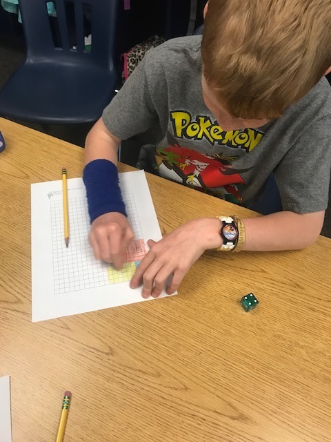 Rolling the dice to find the number of rows and columns! 