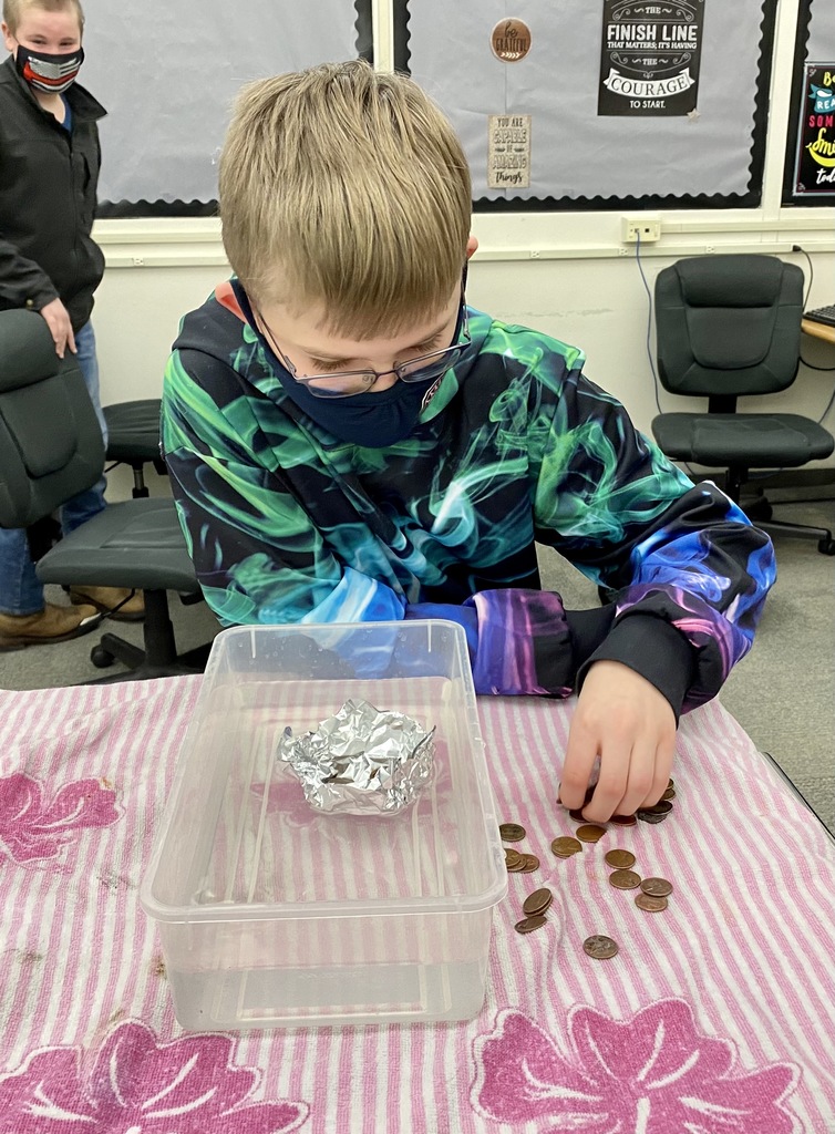 OMS students investigating the problem solving process! During this inquiry, they planned and designed aluminum boats which transport pennies.